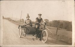 Couple on Indian motorcycle with sidecar Postcard