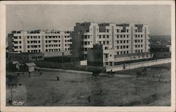 Black and white photo of several large buildings Miscellaneous Cim Postcard Postcard Postcard