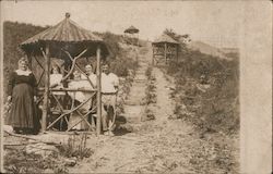 Five people under thatched pavilion Postcard