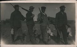 Four duck hunters with shotguns Postcard