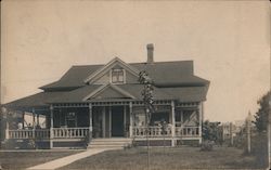 Photograph of the front of a house Postcard