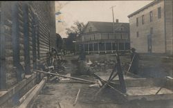 Construction scene between two buildings Postcard