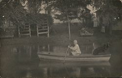 Boy in a Rowboat with His Dog Postcard