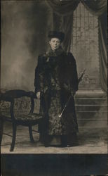 Woman in Fur Coat and Fur Hat Holds Closed Umbrella, Studio Portrait Postcard