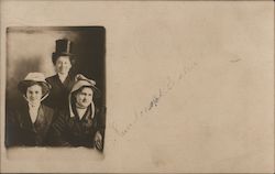 Two women in sunbonnets and one woman in top hat Postcard