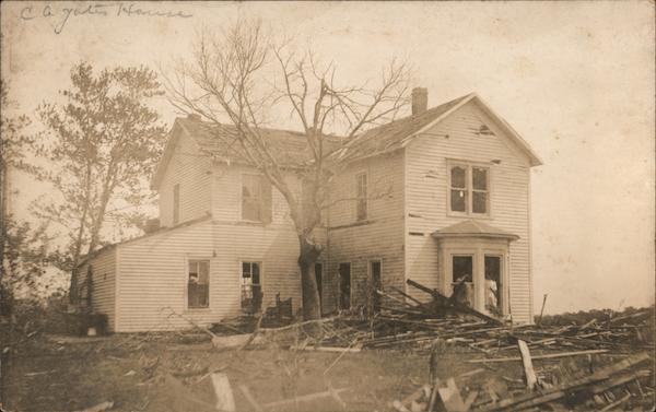 Tornado? White Wooden House with Damage to Exterior Surrounded by Debris Moulton Iowa