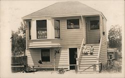 Two Children Outside Residence Postcard