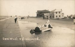 Woman on Cement Bench, Sea Wall Boulevard - Hurricane 1915 Postcard
