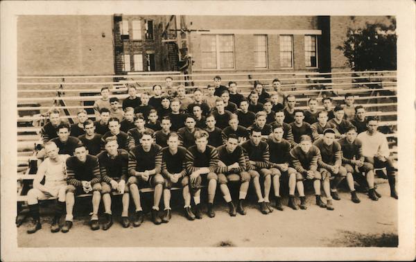 Football Team Posing on Building Steps