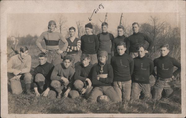 Football Team Kneeling in Field, 1913