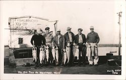 Men displaying Fish they Caught Postcard