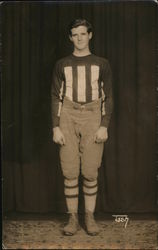 Football Player in Striped Sweater Postcard