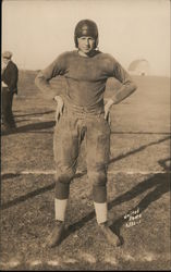 Football Player in Helmet Standing in Field Postcard