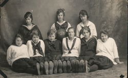 1920 Girls Basketball Team with "BASKETBALL 20" Displayed Across the Soles of their Shoes Postcard