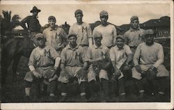 Men's Baseball Team with "M" on Jersey and Man on Horseback in the Background Postcard