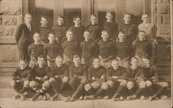1925 Football Team Posing in Front of Building Postcard