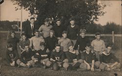 Football Team Posing in Field Postcard
