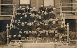 1913 Football Team Seated on Building Steps Postcard