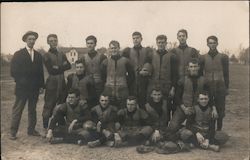 Football Team Posing in Field Postcard