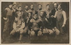 1908 "C.W." Football Team Seated in Vests Postcard