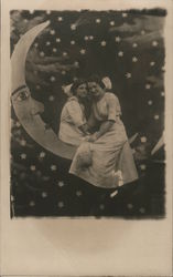 Two Young Women on a Paper Moon (wearing dresses) Postcard