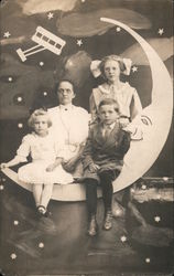 Woman, One Young Woman, One Girl and One Boy on a Paper Moon Postcard