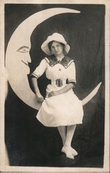 Woman in White Dress Sitting on Paper Moon Postcard