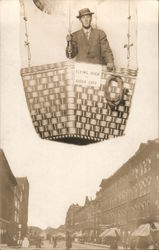 Man in a hat posing in hot air balloon Studio Photo Postcard
