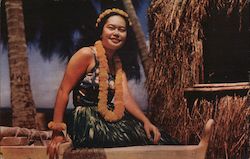 Hawaiian Hula Girl poses on an outrigger canoe on the beach Postcard