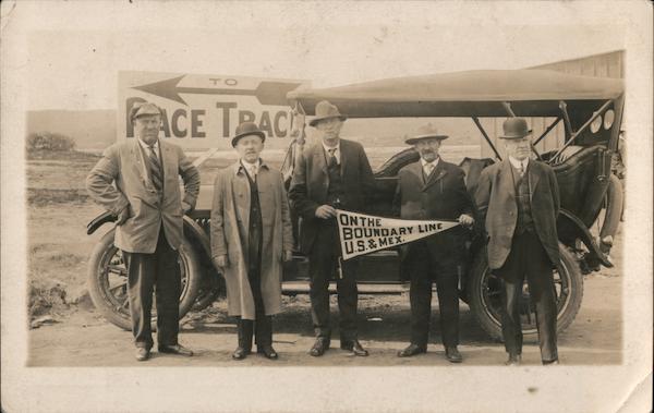 On the Boundary Line U.S. & Mexico - Five men standing in front of a car