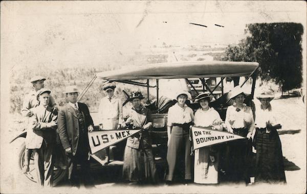People posing holding flags: US & Mex, On the Boundary Line Mexico
