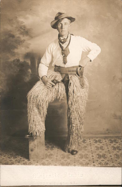 Man Dressed as Cowboy Wooly Chaps Pistol Studio Photos