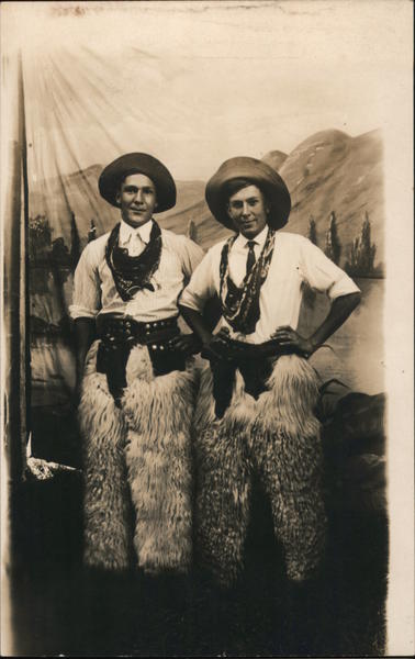 Two Men dressed as Cowboys in a Mountain scene Studio Photos