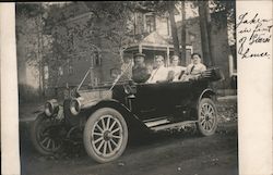 Men and Women in Car in Front of Large House Postcard