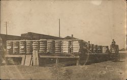 Workers with Bales at Railroad Depot Postcard