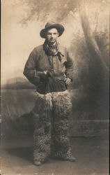 Cowboy Wearing Wooly Chaps and Holding a Pistol Postcard