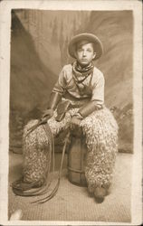 Young Cowboy Poses on Barrel, Wooly Chaps Postcard