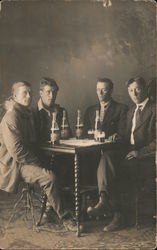 Four Men in Suits and Jackets Drinking Beer Postcard