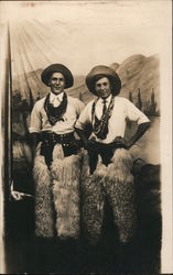 Two Men dressed as Cowboys in a Mountain scene Postcard