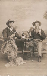 Two Men Dressed as Cowboys Wooly Chaps Holding Pistols, Beer Postcard