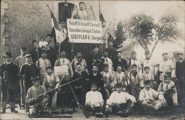 Group of Soldiers in Front of a House While Holding a Sign Gourvilliers France
