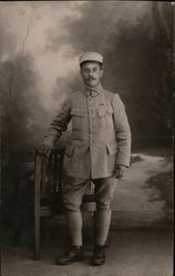 Soldier Posing Alone by a Chair Postcard
