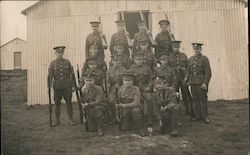 Group of Soldiers in Front of a House While Holding Guns Postcard
