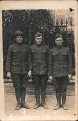 Group of Soldiers - Three Soldiers Siting in Front of a Fence Postcard