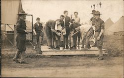 1914 Group of US Soldiers Washing at Pump in Camp Postcard