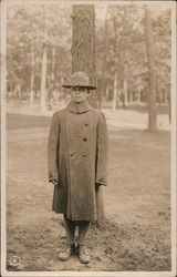 A Lone Soldier Standing Outdoors Postcard