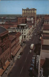 FRONT ST. looking north, showing portion of business section Postcard