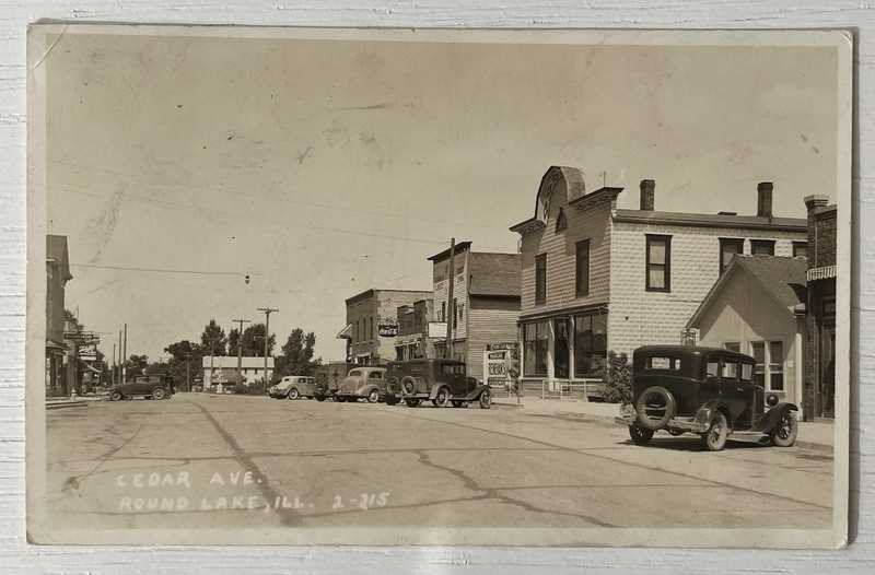 RPPC Business District On Cedar Avenue. Round Lake, Illinois. Schlitz Beer Sign