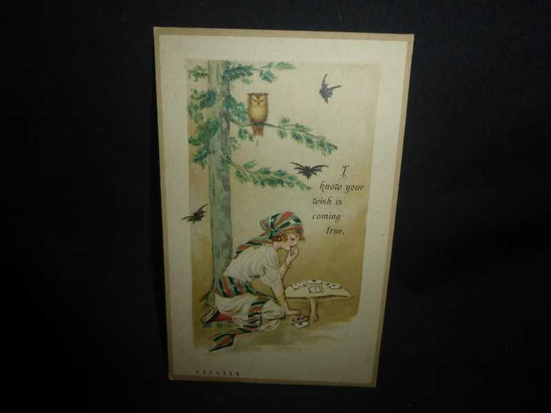SUPER RARE HALLOWEEN POSTCARD--BEAUTIFULY OUNG GIRL PLAYING TAROT