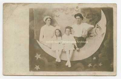 PAPER MOON ~ Family on unusual, puzzled moon ~ early arcade RPPC postcard